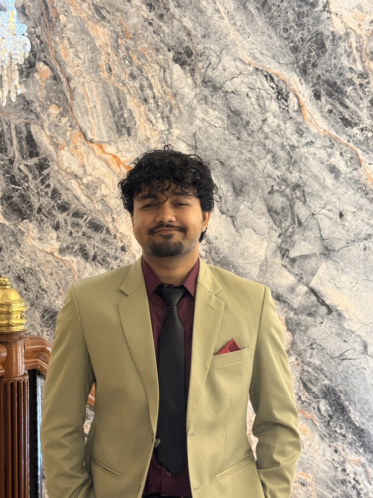Surya wearing a light green suit